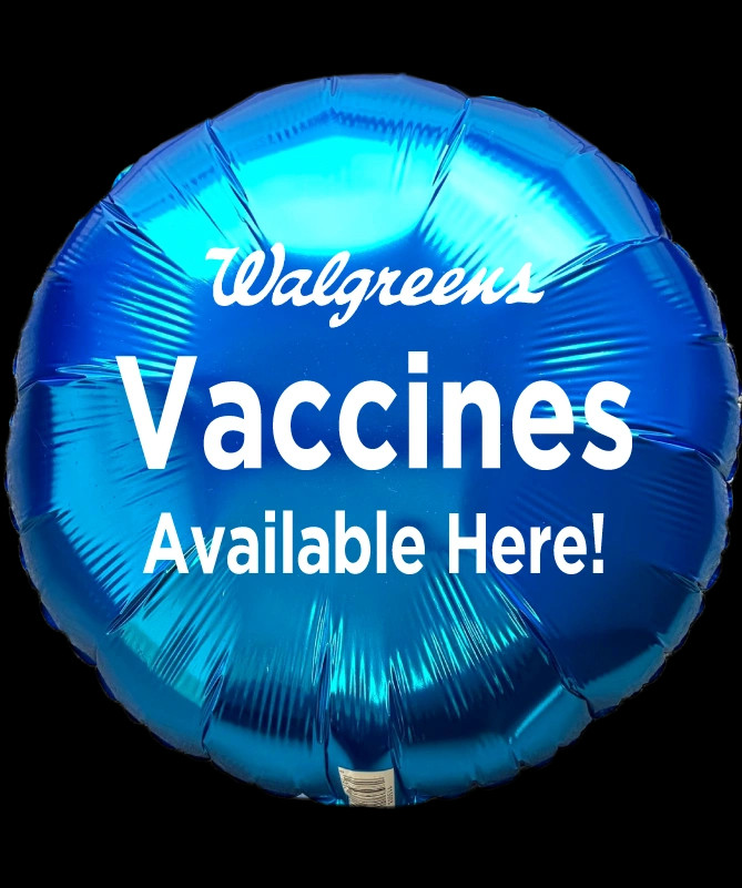 Mylar balloons with text written - vaccines available here.